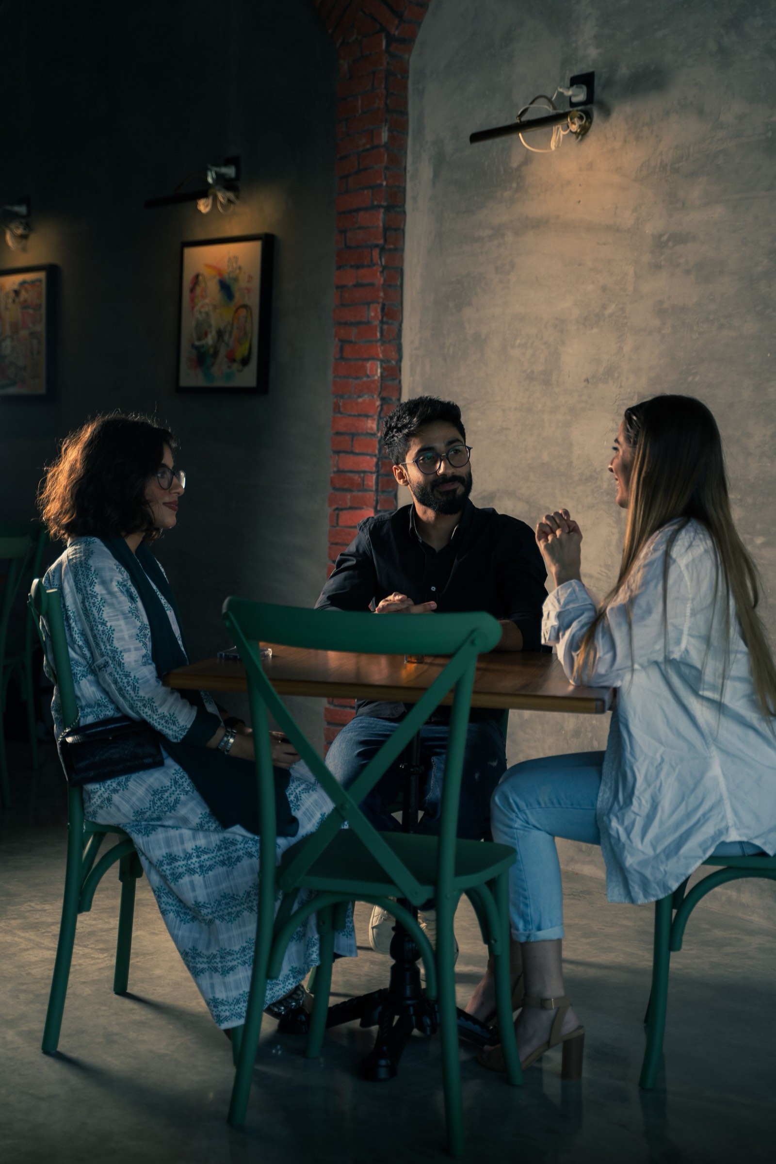 Friends sitting together around a table.