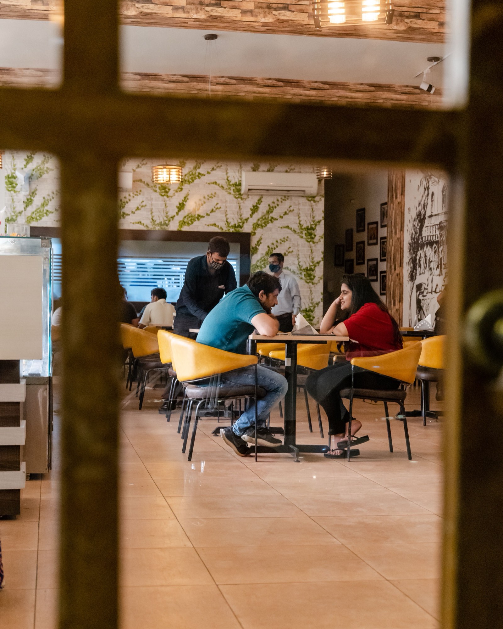 People sitting together at a restaurant table.